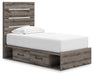 Graystorm bedroom set by Ashley Furniture, featuring a bed, dresser, and nightstands in a modern gray finish, shown from an angled view.