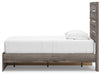 Graystorm bedroom set by Ashley Furniture featuring a modern bed frame and matching nightstands in a cozy bedroom setting.