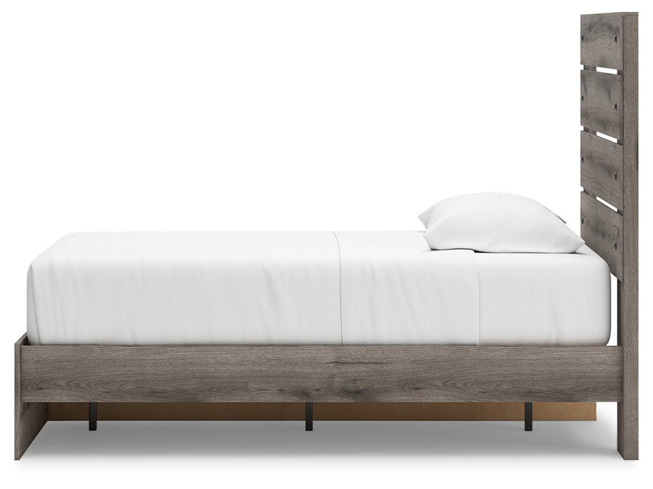 Graystorm bedroom set by Ashley Furniture featuring a modern bed frame and matching nightstands in a cozy bedroom setting.