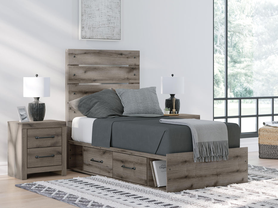 Graystorm bedroom set by Ashley Furniture featuring a bed frame, nightstands, and matching dresser in gray finish.