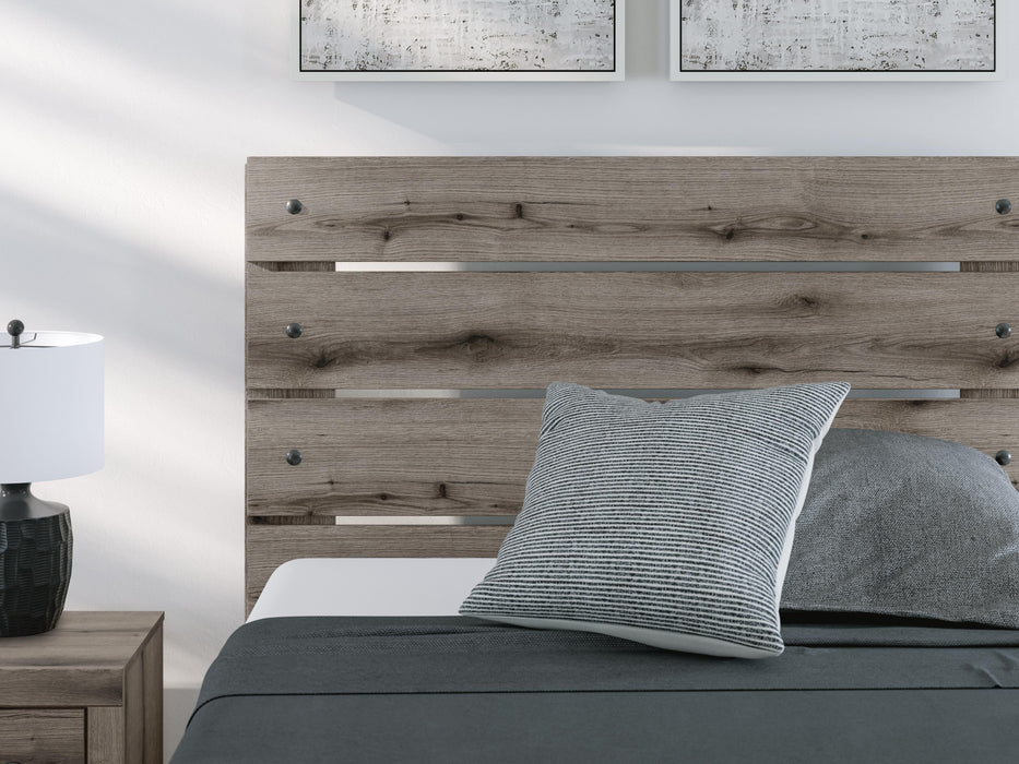 Graystorm bedroom set by Ashley Furniture, featuring a modern bed frame and matching bedroom furniture in a sleek gray finish.