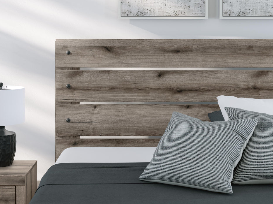 Graystorm bedroom set by Ashley Furniture featuring a bed, nightstands, and matching dresser with modern gray finish.