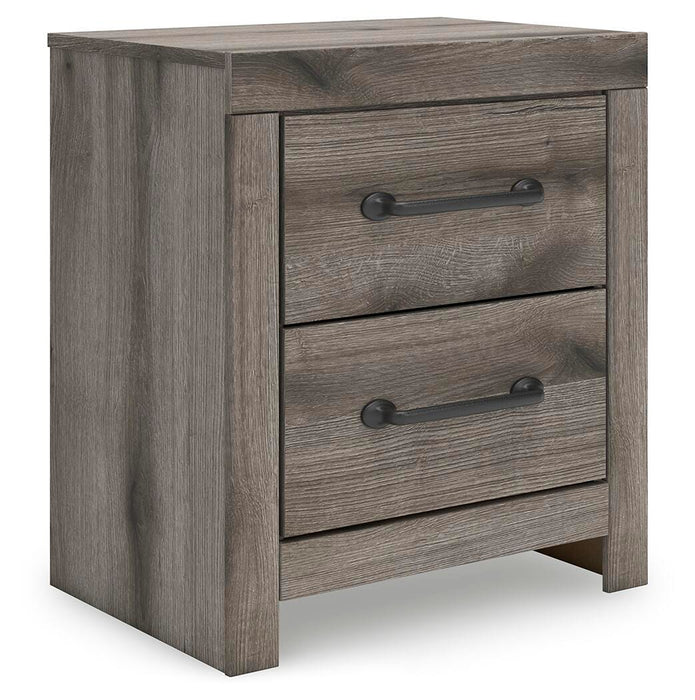 Ashley Furniture Graystorm bedroom set with a modern bed frame, matching nightstands, and dresser in a stylish bedroom scene.