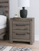 Graystorm Bedroom Set by Ashley Furniture featuring a modern bed frame, matching nightstands, and a coordinated dresser in a gray finish.