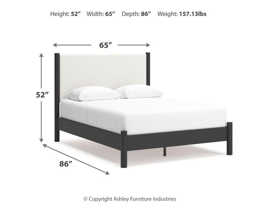 Ashley Furniture Cadmori bedroom set with a bed, dresser, and nightstands in a modern bedroom design.
