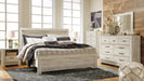 Ashley Furniture Bellaby Bed in neutral fabric with a modern design, showcasing clean lines and a sturdy frame.