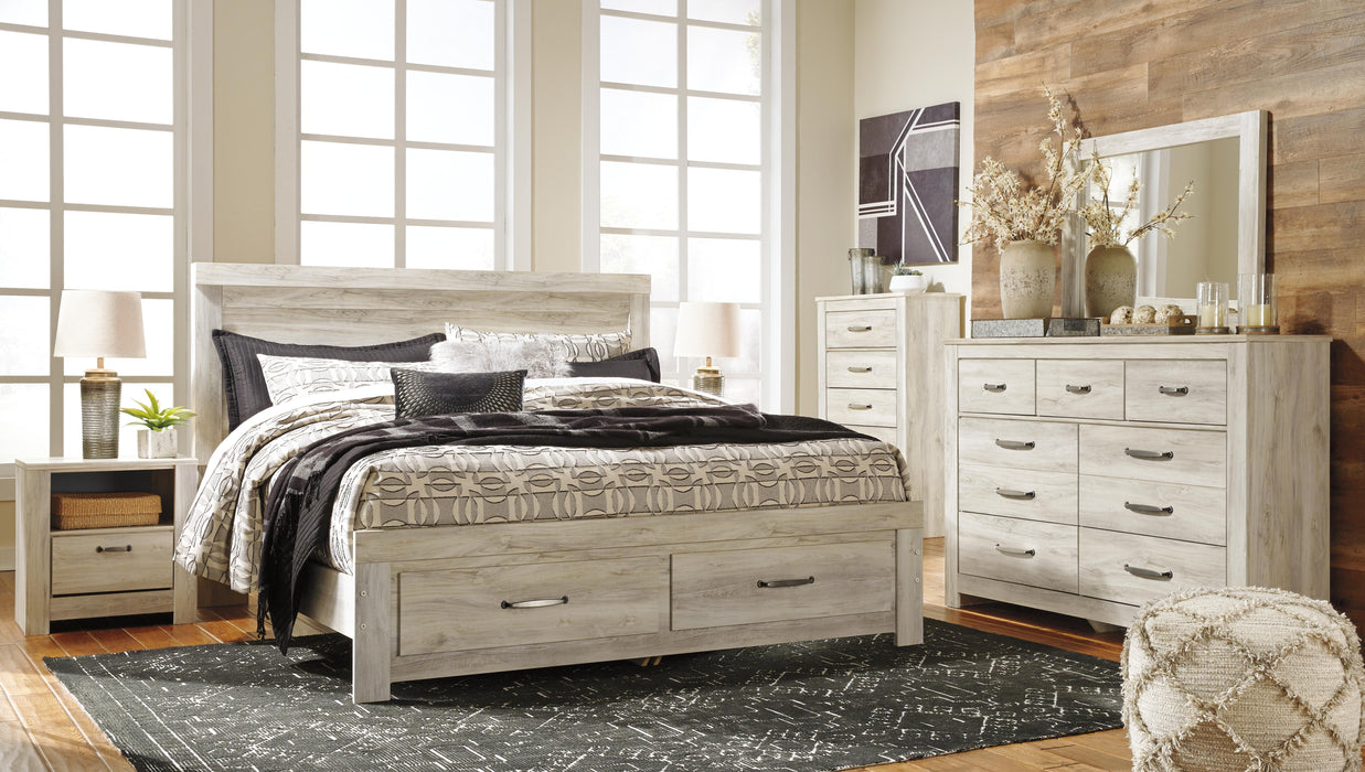 Ashley Furniture Bellaby Bed with a classic wooden frame, showcasing detailed craftsmanship and a warm finish.