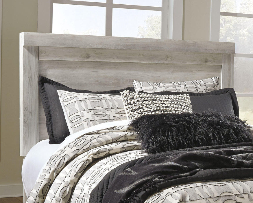 Ashley Furniture Bellaby Bed with dark wood finish, showcasing a modern bed frame with upholstered headboard and sleek design.