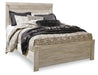 Ashley Furniture Bellaby Bed with a sturdy wooden frame and a classic design, shown in a natural wood finish.