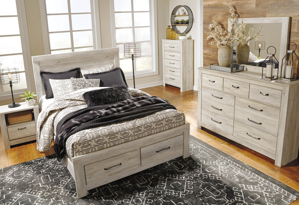 Ashley Furniture Bellaby Bed with a sturdy frame and elegant design, showcasing the headboard and footboard in a modern bedroom setting.