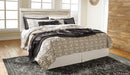 Ashley Furniture Bellaby Bed with a wooden frame and headboard, showcasing a modern, stylish bedroom furniture piece.