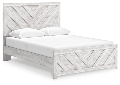 Ashley Furniture Cayboni Bed with angled view showcasing the modern design and warm wood finish in a bedroom setting.