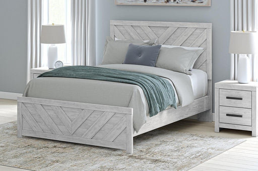 Ashley Furniture Cayboni Bed in a modern bedroom setting, showcasing a stylish bed frame with a sleek headboard and neutral upholstery.