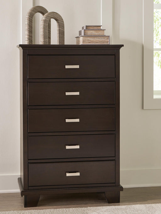 Ashley Furniture Covetown chest of drawers with a rustic wood finish and multiple drawers for storage.