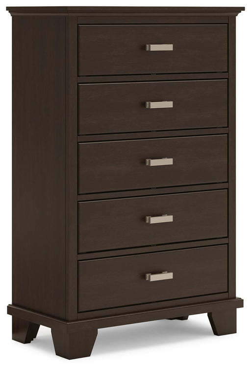 Ashley Furniture Covetown Chest of Drawers with multiple drawers and sleek wood finish, shown from an angled closed view.