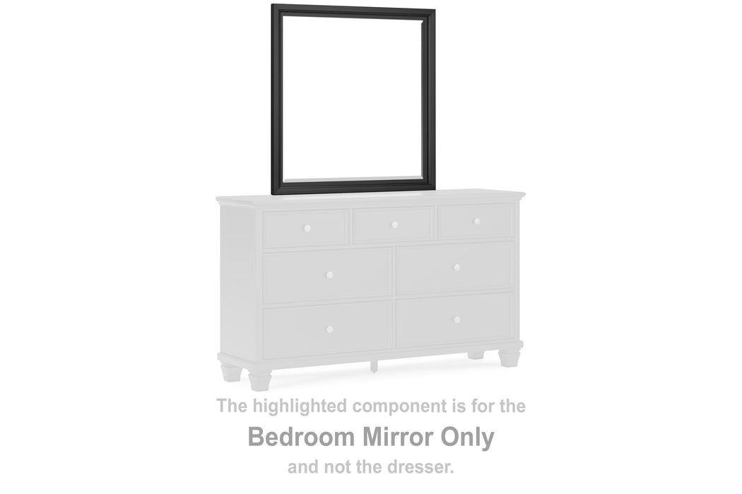 Ashley Furniture Lanolee bedroom mirror with a sleek, modern frame, hanging on a wall in a well-lit bedroom setting.