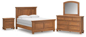Ashley Furniture Feddinger bedroom set featuring a modern bed frame, matching nightstands, and a stylish dresser in a cozy bedroom setting.