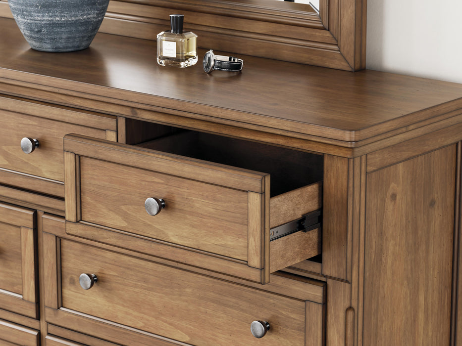 Ashley Furniture Feddinger bedroom set with bed frame, nightstand, and dresser in a stylish, modern bedroom setup.