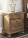 Ashley Furniture Feddinger bedroom set with a bed frame, matching nightstands, and dresser in a modern bedroom scene.