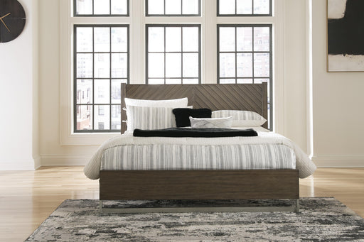 Ashley Furniture Arkenton Bed with a sleek wooden frame and modern design, shown in a cozy bedroom setting.
