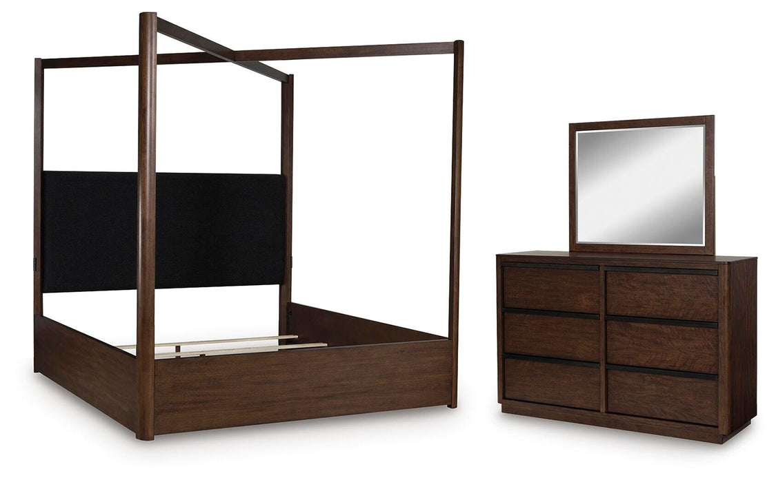 Ashley Furniture Dilenno bedroom set showing a modern bed frame with matching nightstands and dresser in a stylish bedroom scene.