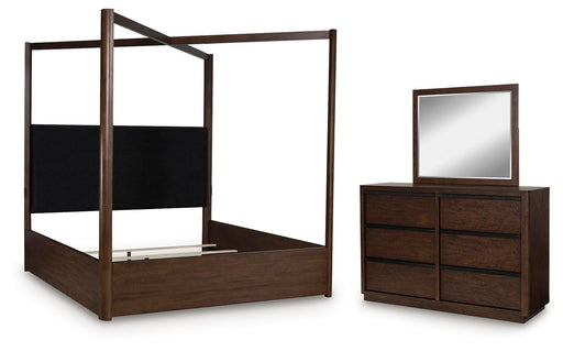 Ashley Furniture Dilenno bedroom set showing a modern bed frame with matching nightstands and dresser in a stylish bedroom scene.