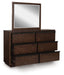 Ashley Furniture Dilenno bedroom set with a bed, nightstands, and dresser in a modern bedroom scene.