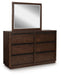 Ashley Furniture Dilenno bedroom set featuring a modern bed frame with matching nightstands and dresser in a stylish bedroom.