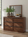 Ashley Furniture Dilenno bedroom set featuring a modern bed frame and matching furniture in a stylish bedroom setting.