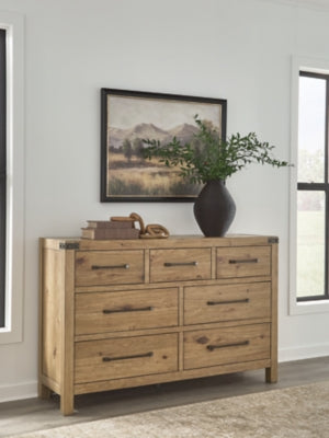 Ashley Furniture Ridgester Dresser with four drawers and a dark wood finish, shown in a close-up of the dresser's front.