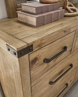 Ashley Furniture Ridgester dresser and mirror set with wood finish and detailed hardware, showcasing the elegant bedroom furniture.
