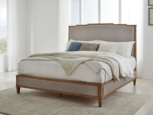 Ashley Furniture Sharlance King Upholstered Bed with padded headboard and stylish fabric in a modern bedroom setting.