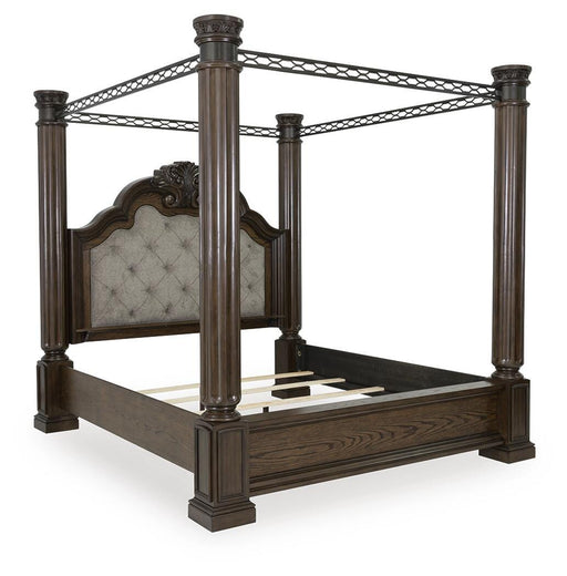 Ashley Furniture Maylee Bed with a plush upholstered headboard, shown from a side angle in a modern bedroom setting.