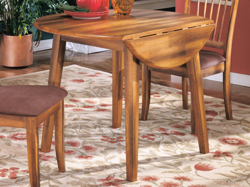 Ashley Furniture Berringer dining drop leaf table with wooden finish, showcasing a versatile rectangular dining table with foldable leaves.