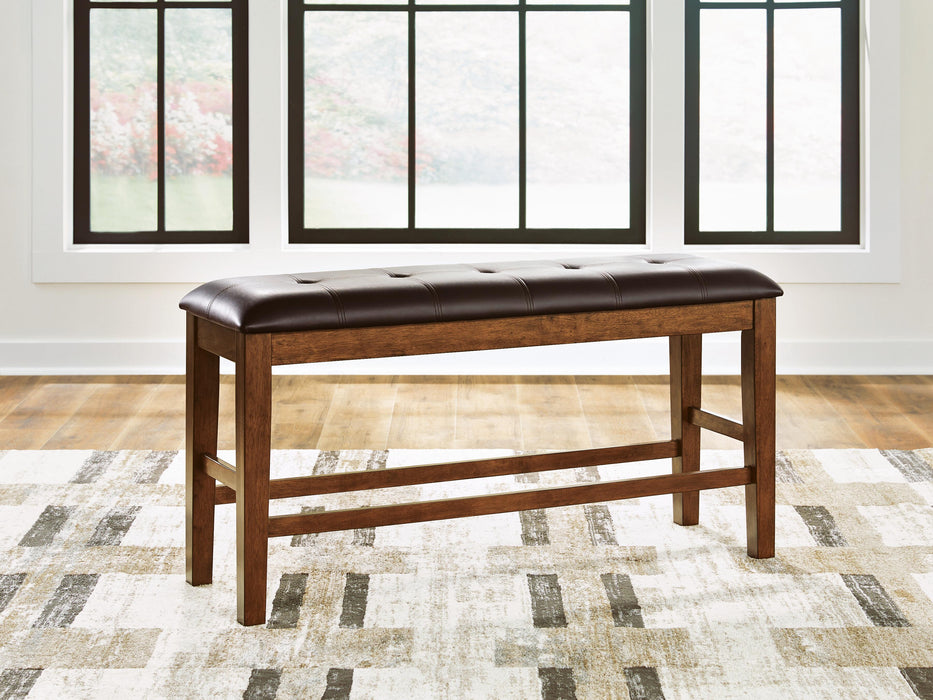 Ashley Furniture Ralene counter height dining bench with wooden legs and cushioned seat for kitchen or dining room use.