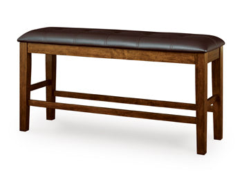 Ashley Furniture Ralene counter height dining bench with wooden legs and upholstered seat, angled view.