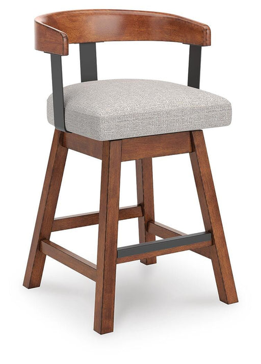 Two Ashley Furniture Ralene counter height barstools with wooden legs and upholstered seats, shown from an angled side view.