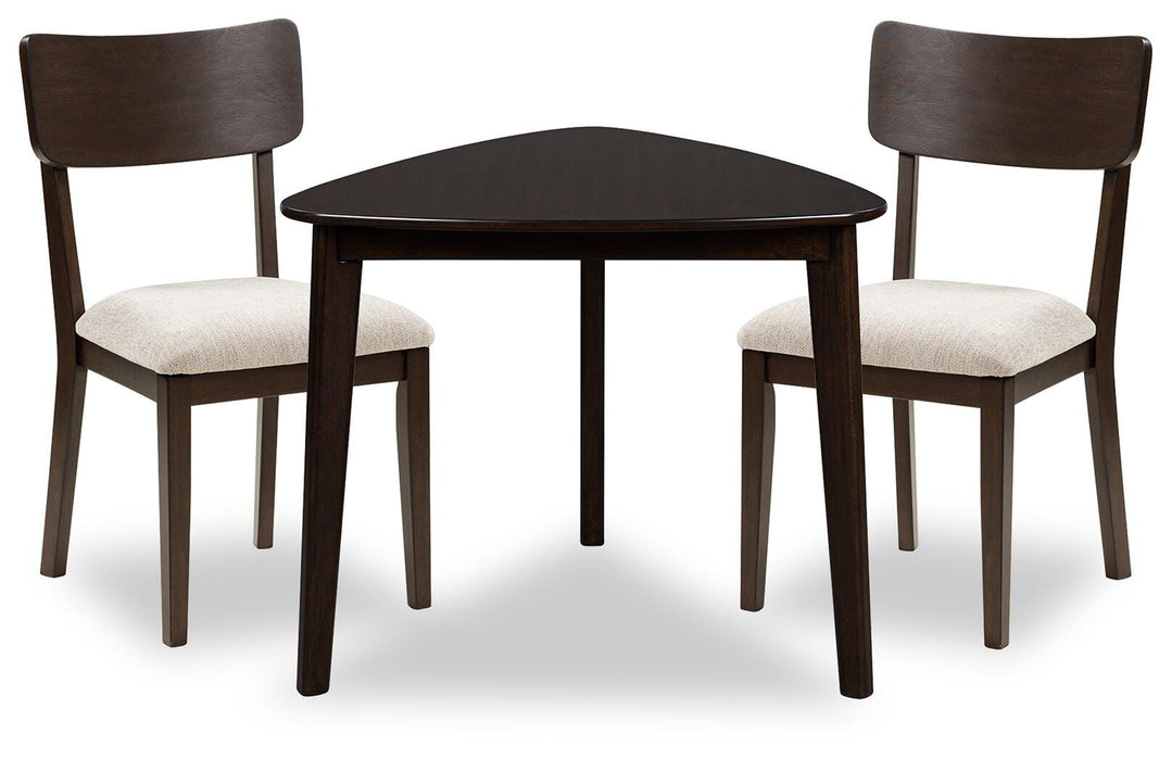 Ashley Furniture Mallenette dining room set with a table and matching chairs in a modern, stylish dining area.