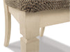Close-up of Ashley Furniture Bolanburg dining room set with wooden table and matching chairs, detailed view of the table surface.
