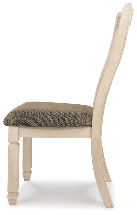 Ashley Furniture Bolanburg dining room set with a rectangular table and six upholstered chairs, shown from a side angle.
