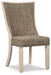 Ashley Furniture Bolanburg dining room set with a wooden table and matching chairs, showcasing a modern design in a bright dining area.