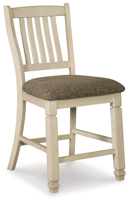 Ashley Furniture Bolanburg dining room set with a table and chairs, shown from an angled view in a modern dining space.