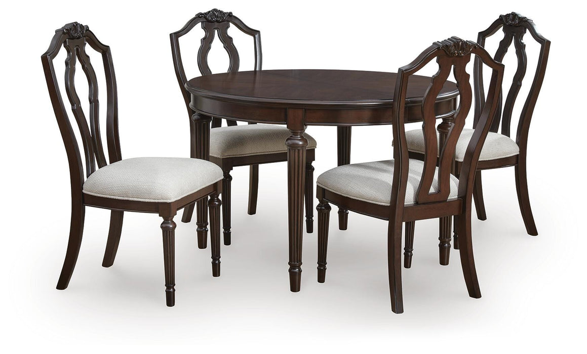 Ashley Furniture Lavinton Dining Package with a wooden dining room set, including a table and matching chairs, in a modern design.