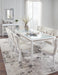 Ashley Furniture Chalanna dining room set with table and chairs, modern design in a warm wood finish.