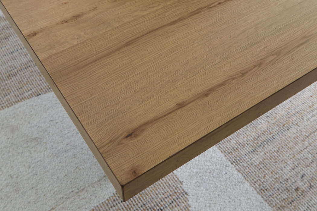 Close-up of the Ashley Furniture Galliden dining table top showcasing its wood grain and sleek design details.