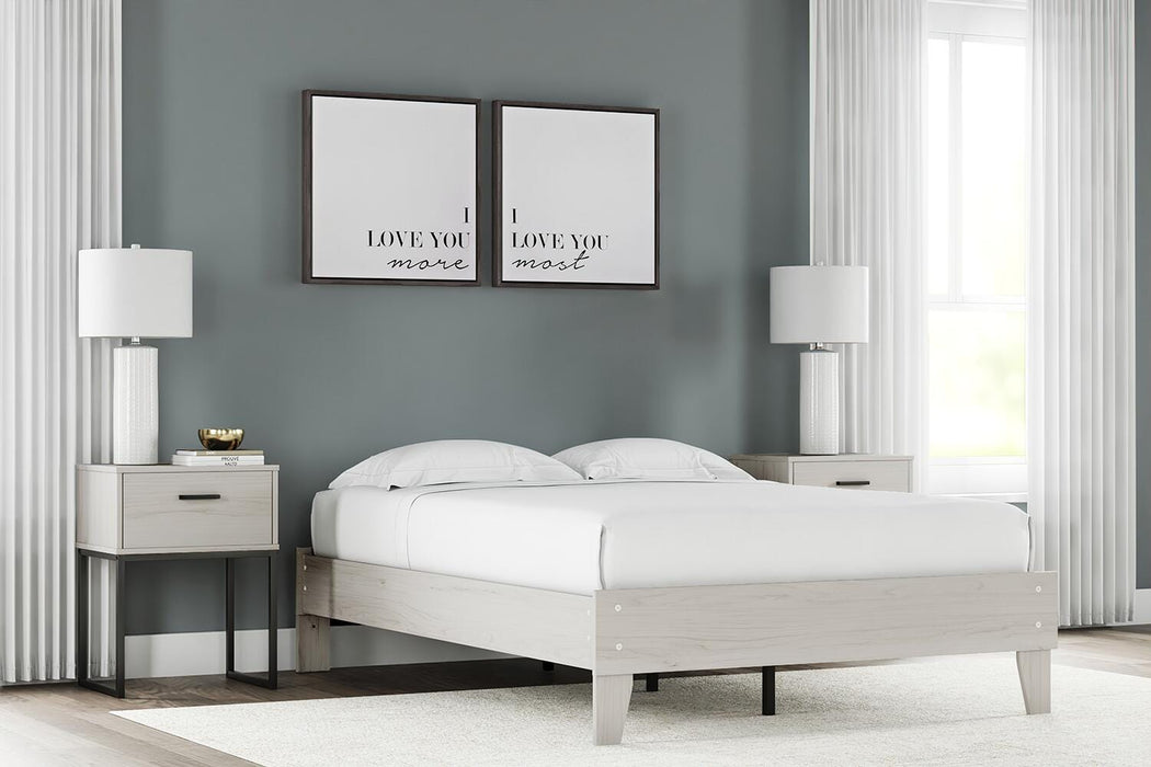 Ashley Furniture Socalle Bed with a modern wooden frame and neutral finish, showcasing a stylish bedroom centerpiece.