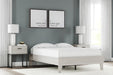 Ashley Furniture Socalle Bed with a modern wooden frame and neutral finish, showcasing a stylish bedroom centerpiece.