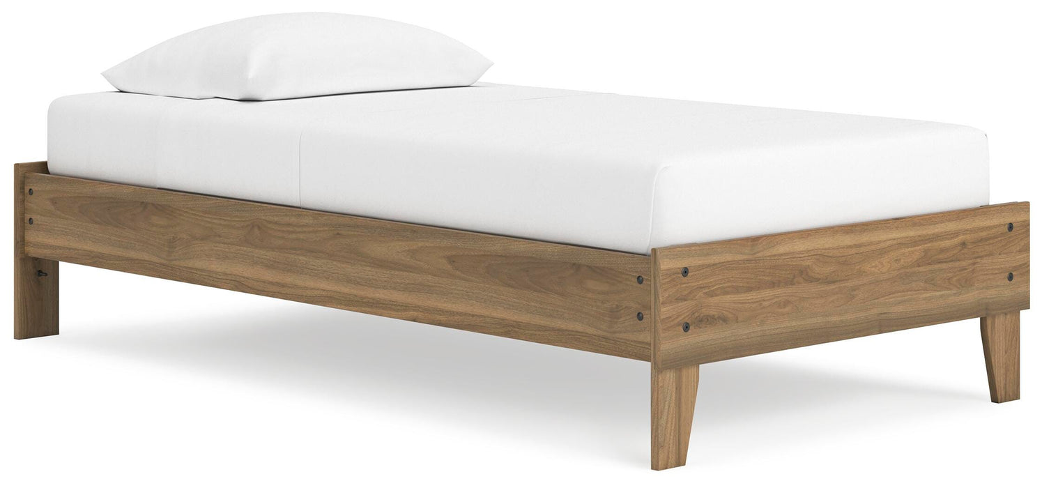 Ashley Furniture Deanlow Bed with a modern frame and headboard, shown from a side angle in a stylish bedroom setting.