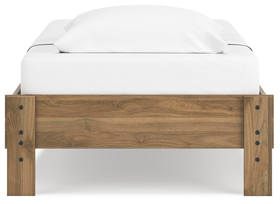Ashley Furniture Deanlow Bed with a sturdy wooden frame and headboard, shown from the back in a stylish bedroom setting.