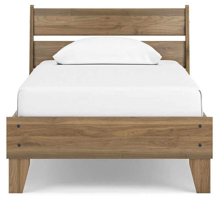 Ashley Furniture Deanlow Bed with a stylish headboard, showcasing a modern bedroom design with neutral-toned bedding.
